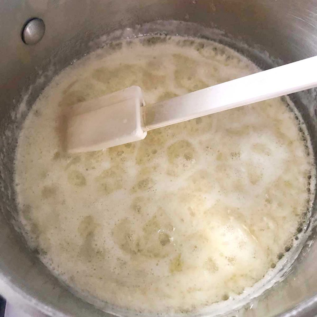cooking butter and sweetener in pan with spatula