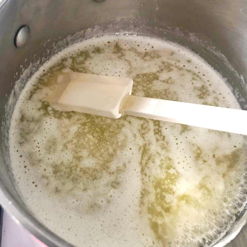 melted butter in pan with spatula