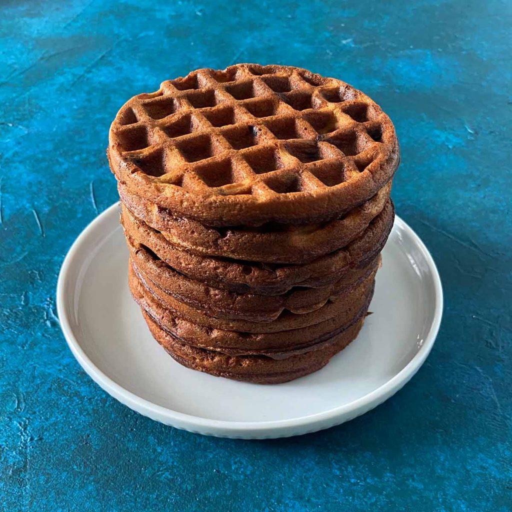 six chocolate chaffles in stack on plate