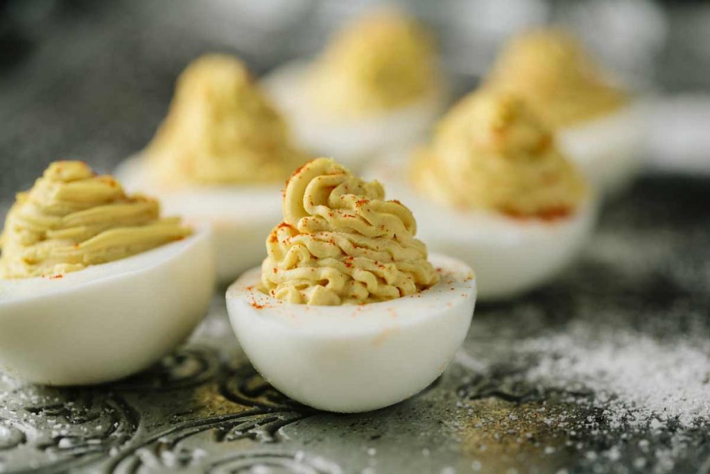 six deviled eggs with paprika