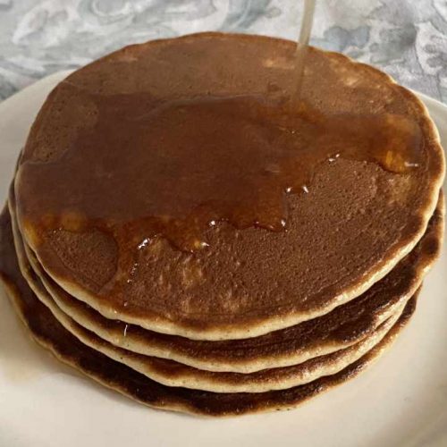 stack of almond flour pancakes with syrup