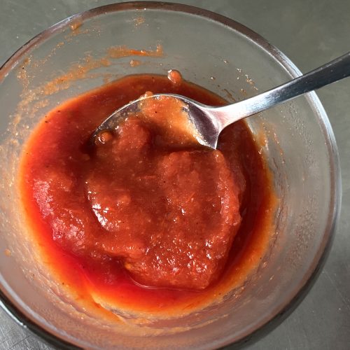 ketchup in bowl with spoon