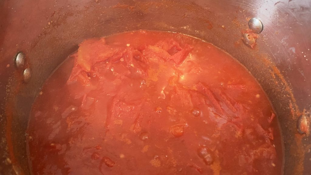 tomatoes cooking in stockpot