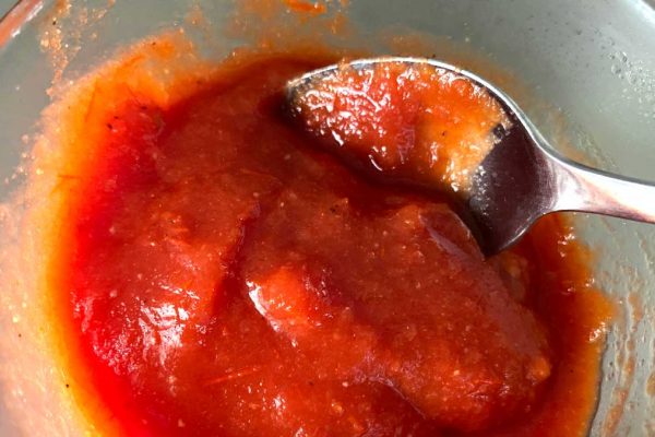 homemade ketchup in bowl with spoon