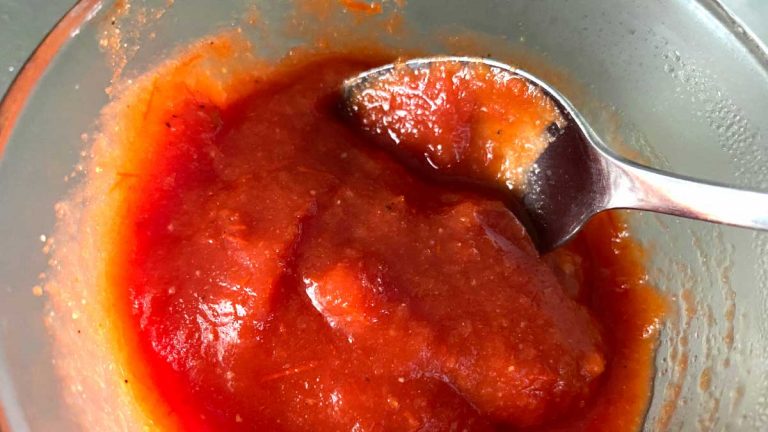 homemade ketchup in bowl with spoon