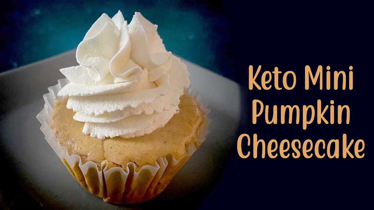 keto mimi pumpkin cheesecake with whipped cream in a cupcake wrapper